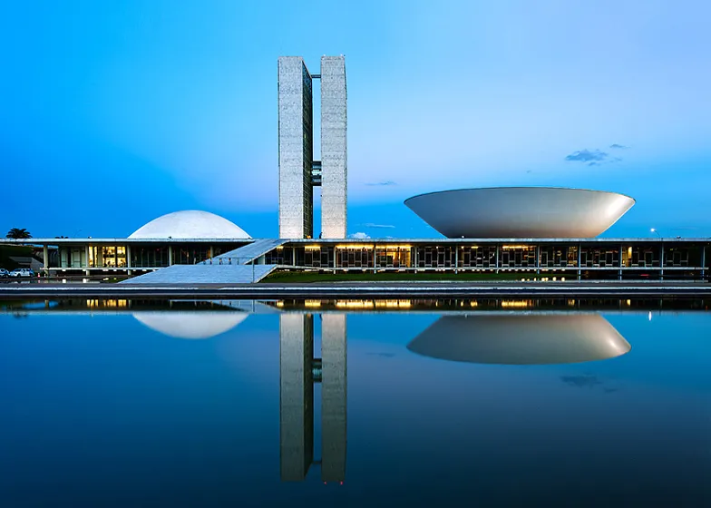The National Congress of Brazil in Brasília, a modernist government complex by Oscar Niemeyer with twin towers and dome-and-bowl assembly halls, completed in 1960
